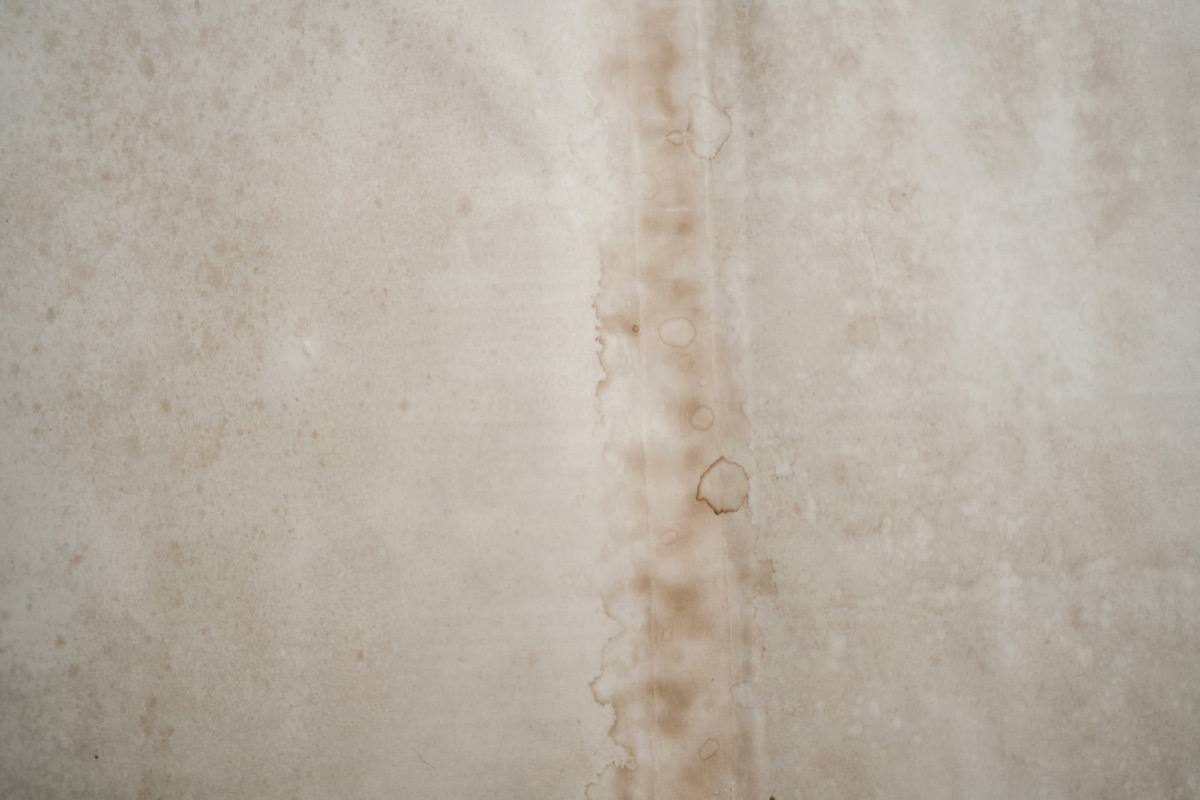 Water stain on a ceiling from a roof leak